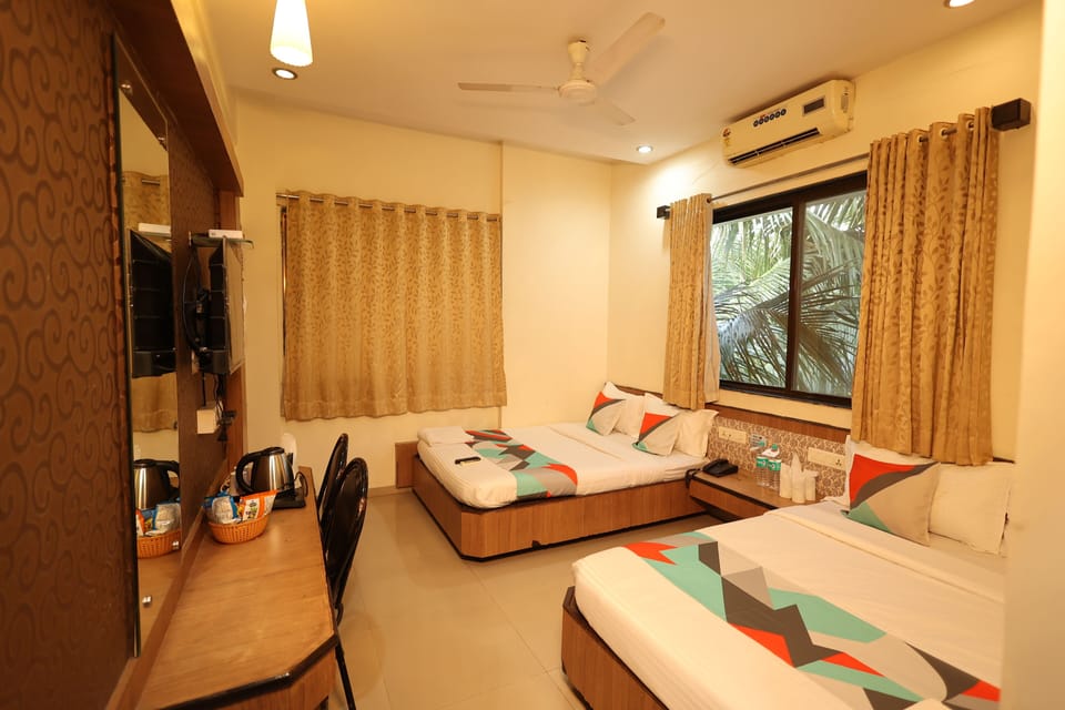 Deluxe Quadruple Room, 1 Bedroom | In-room safe, desk, blackout drapes, iron/ironing board