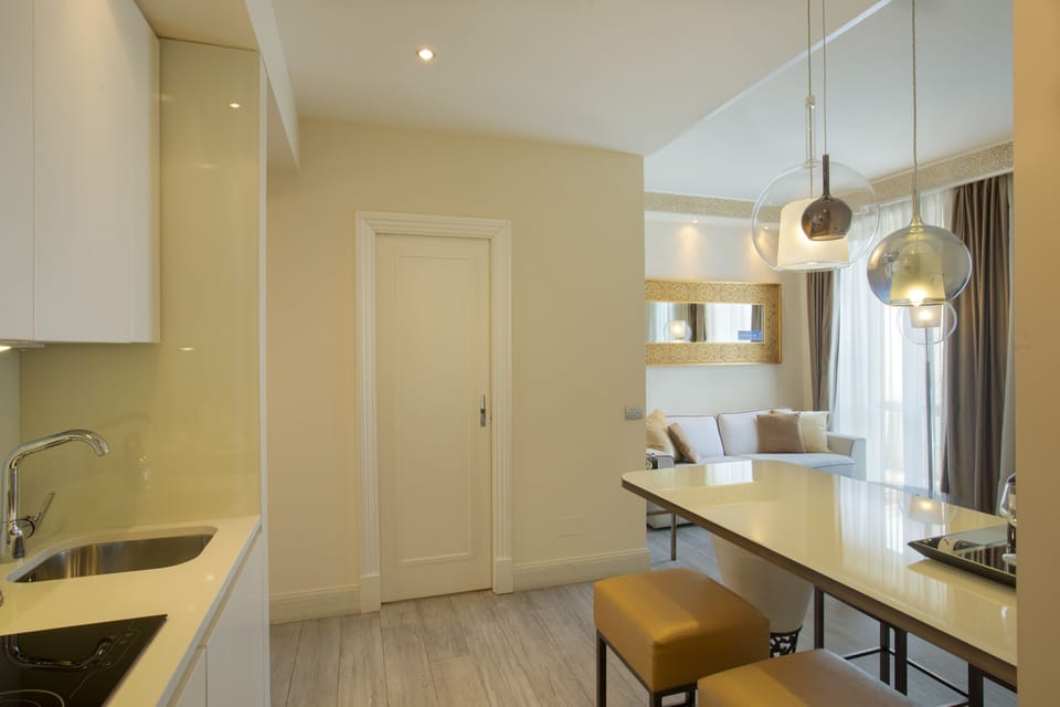 Junior Suite, Kitchenette | Living area | Flat-screen TV, first-run movies