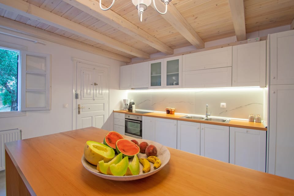 Deluxe Villa | Private kitchen | Coffee/tea maker, electric kettle, cleaning supplies, freezer