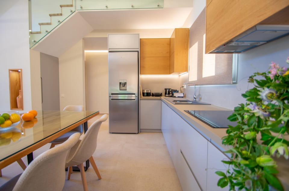 Deluxe Villa | Private kitchen | Espresso maker, coffee/tea maker, full-size fridge, microwave