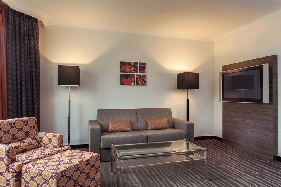 Executive Suite, 1 Bedroom | Living room | LED TV, pay movies