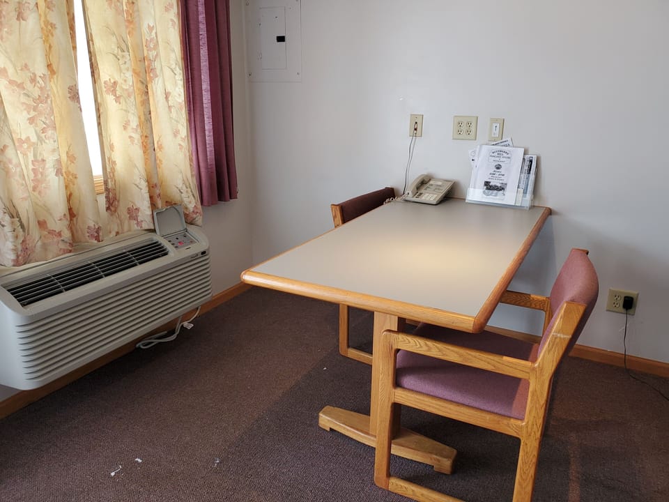 Comfort Room, 1 King Bed | Down comforters, desk, iron/ironing board, free rollaway beds