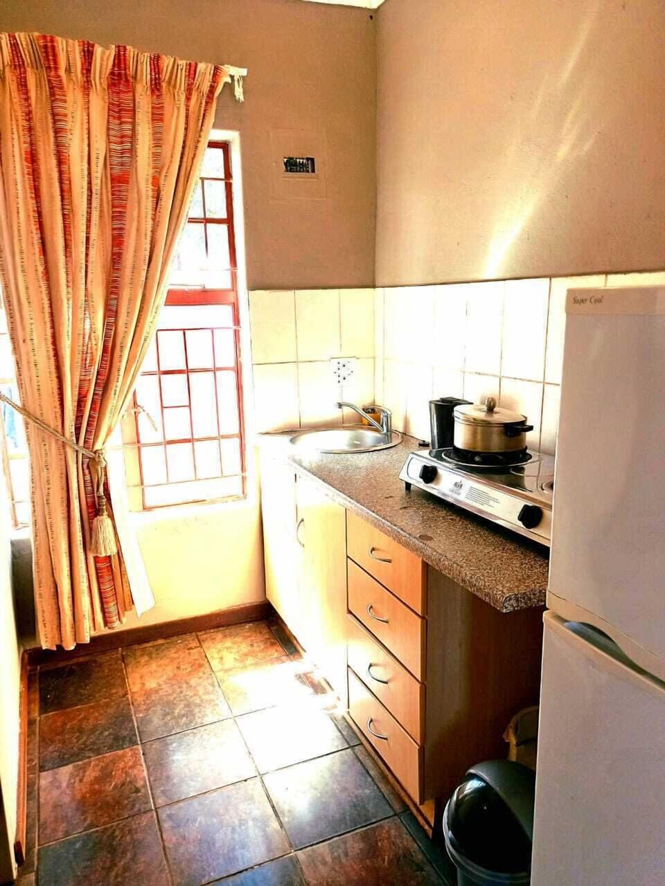 Double Room | Private kitchen | Coffee/tea maker, stovetop, cookware/dishes/utensils