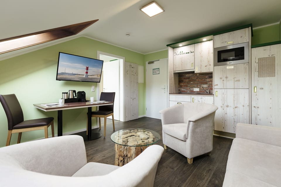 Apartment, 1 Bedroom | Living area | 32-inch flat-screen TV with satellite channels, TV