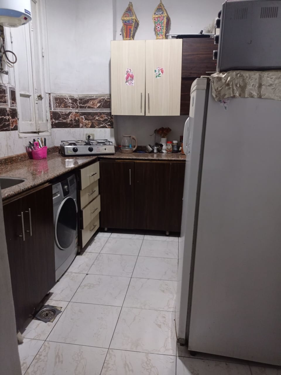 Mini-fridge, microwave, oven, cookware/dishes/utensils