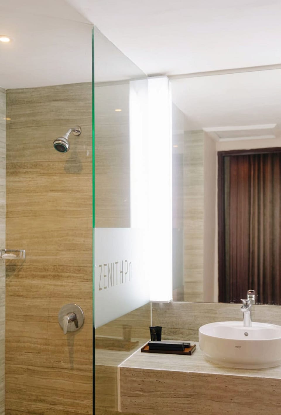 Shower, rainfall showerhead, slippers, towels