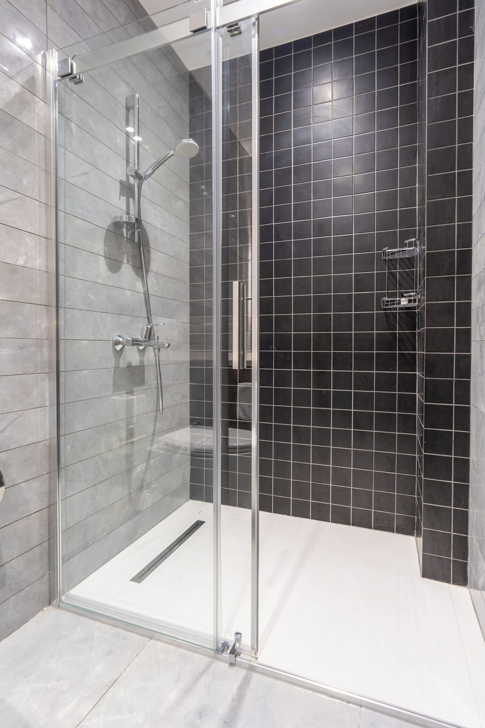 Shower, hair dryer, slippers, towels