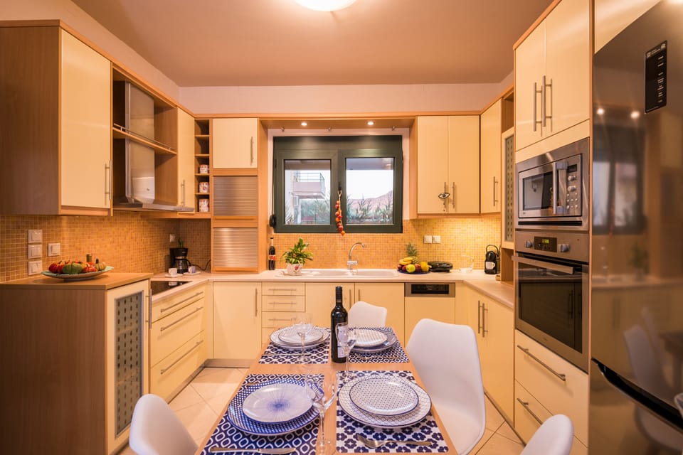 Exclusive Villa | Private kitchen | Full-size fridge, microwave, oven, stovetop