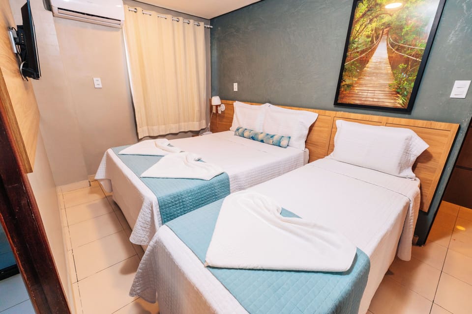 Standard Triple Room, Multiple Beds | Minibar, individually decorated, desk, soundproofing