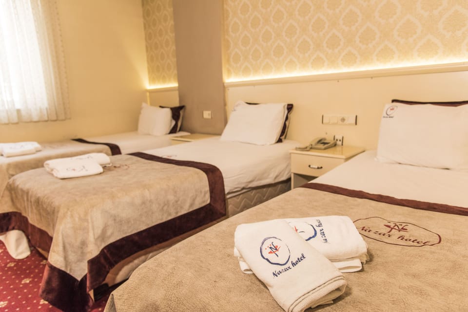 Triple Room | Premium bedding, minibar, in-room safe, blackout drapes