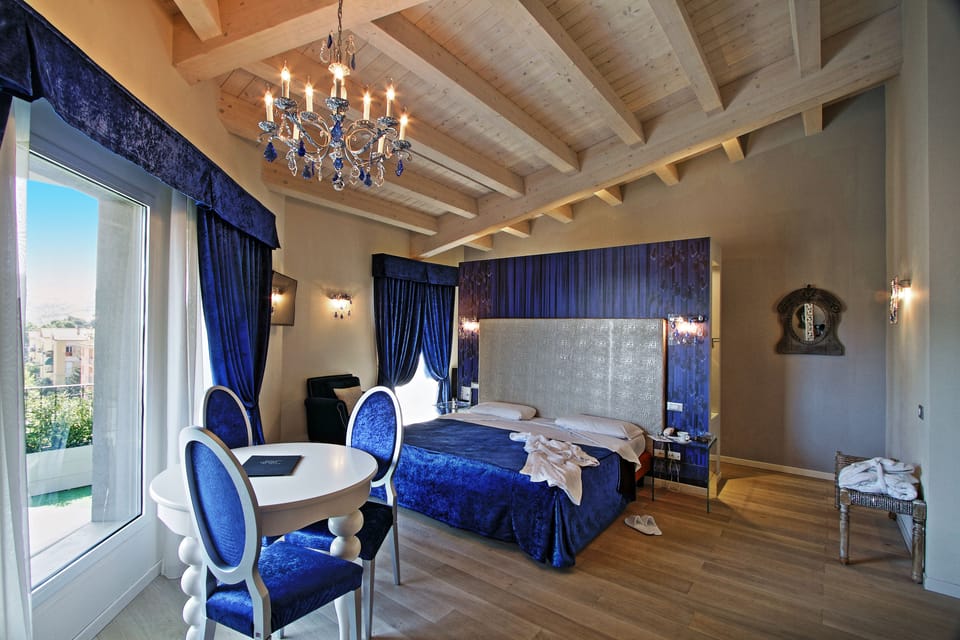 Suite with Balcony and Spa Bath | Hypo-allergenic bedding, down comforters, minibar, in-room safe