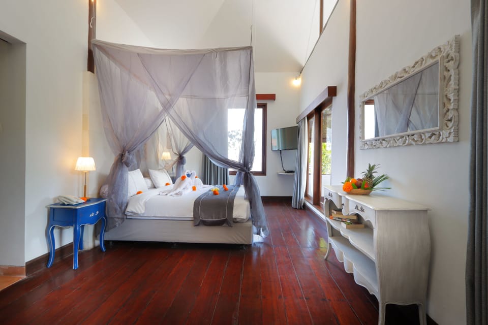 Deluxe Double Room, Pool View | In-room safe, desk, iron/ironing board, bed sheets