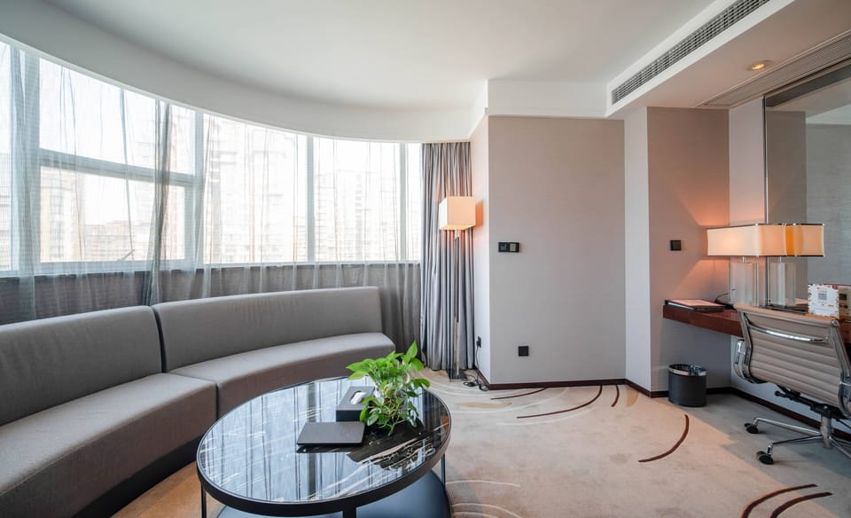 Suite, 1 King Bed, Non Smoking | Minibar, in-room safe, rollaway beds (surcharge), WiFi (free)
