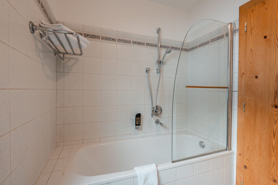 Family Apartment, 1 Bedroom, Balcony, Mountain View (Sonnenstein) | Bathroom | Combined shower/tub, hair dryer, bathrobes, slippers
