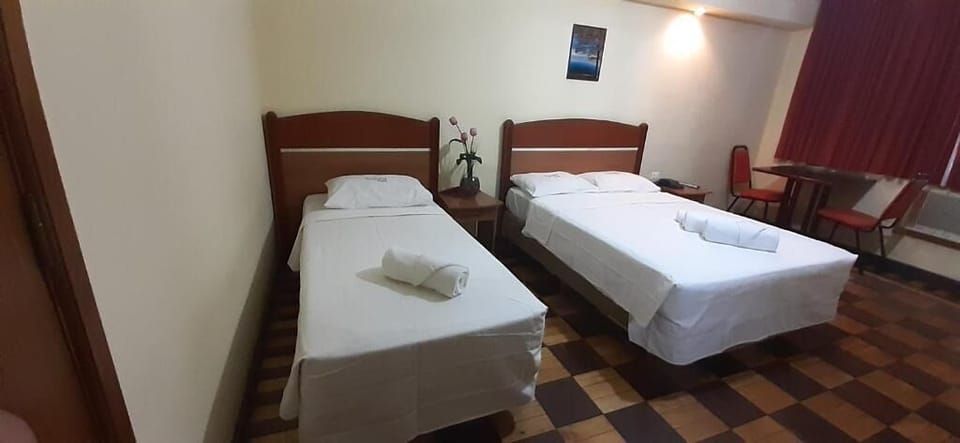 Quadruple Room | Minibar, desk, blackout drapes, bed sheets