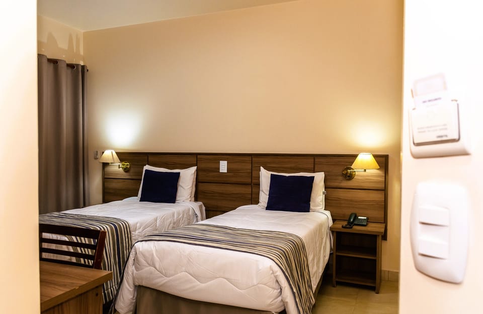 Standard Twin Room | Minibar, in-room safe, desk, laptop workspace