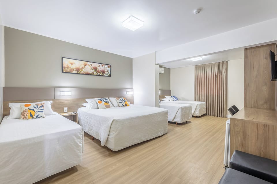 Family Room | Minibar, in-room safe, blackout drapes, iron/ironing board