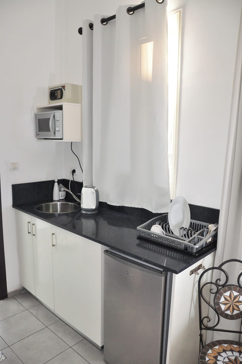 Fridge, microwave, electric kettle, cookware/dishes/utensils