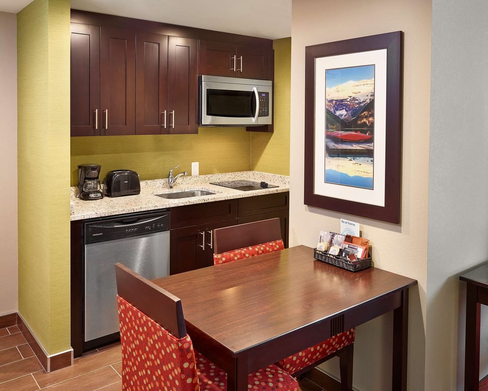 Suite, 1 King Bed | Private kitchen | Full-size fridge, microwave, stovetop, dishwasher