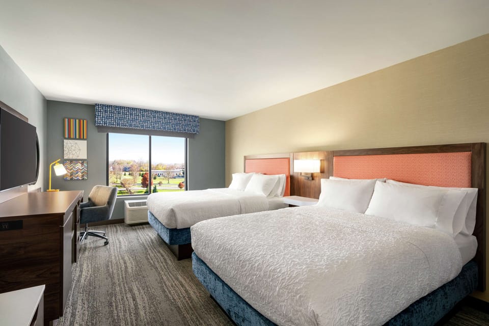 Room, 2 Queen Beds, Refrigerator | In-room safe, desk, bed sheets