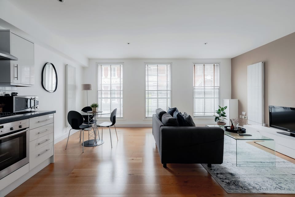 Deluxe Apartment | Living area | 32-inch flat-screen TV with digital channels, TV, DVD player