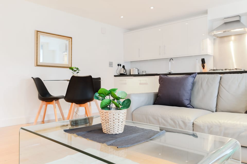 Deluxe Apartment | Living area | 32-inch flat-screen TV with digital channels, TV, DVD player