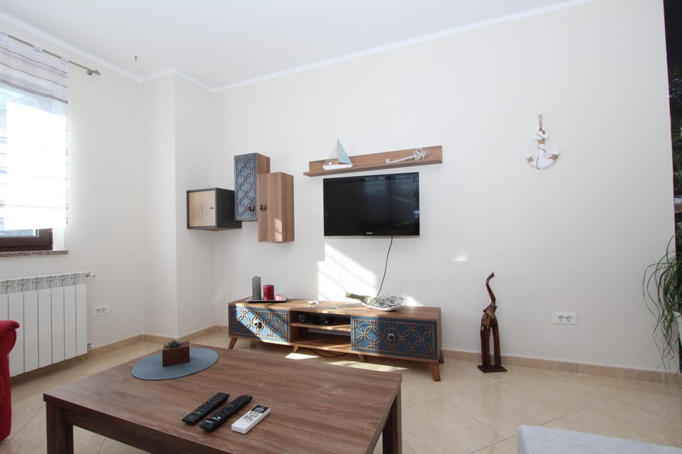 Apartment, 1 Bedroom, Non Smoking, Balcony | Living area | 60-inch flat-screen TV with satellite channels, TV