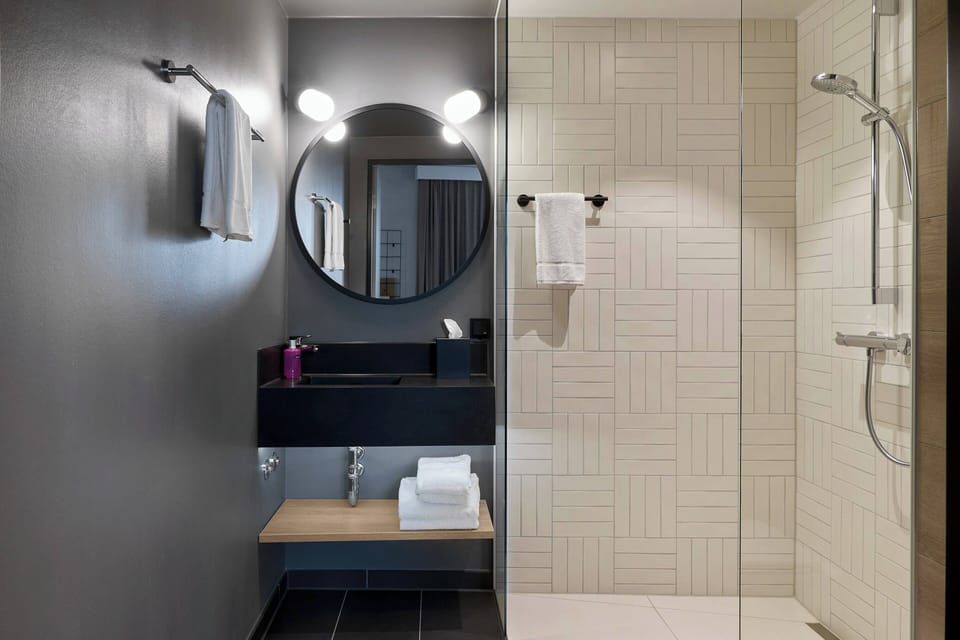 Family Room, 1 Queen Bed with Sofa bed | Bathroom | Shower, hair dryer, towels, soap