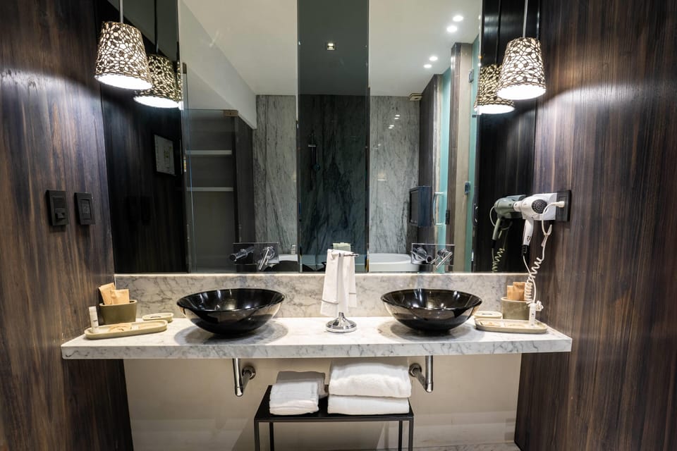 Suite, 1 King Bed (VIP) | Bathroom | Shower, rainfall showerhead, free toiletries, hair dryer