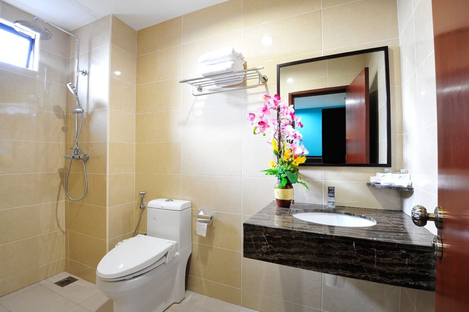 Rainfall showerhead, designer toiletries, hair dryer, slippers