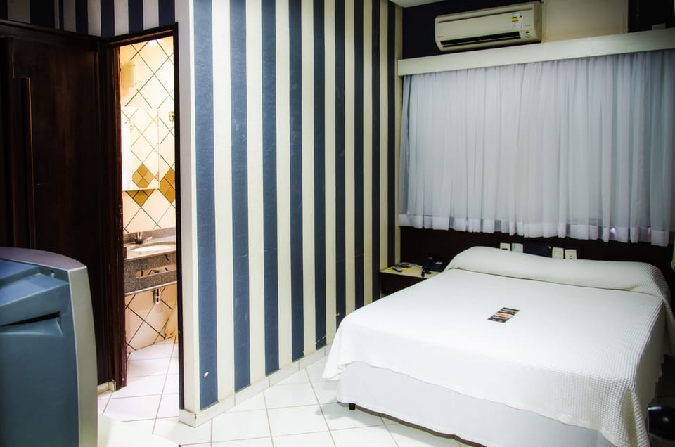 Deluxe Double Room, Ground Floor | Minibar, in-room safe, individually furnished, desk