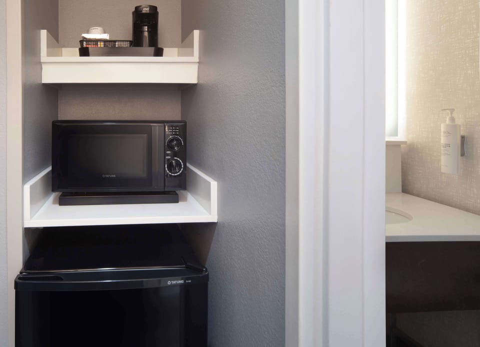 Desk, laptop workspace, blackout drapes, iron/ironing board