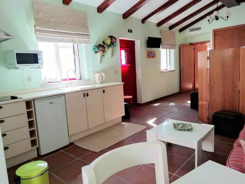 Studio | Private kitchenette | Microwave, electric kettle, highchair, dining tables