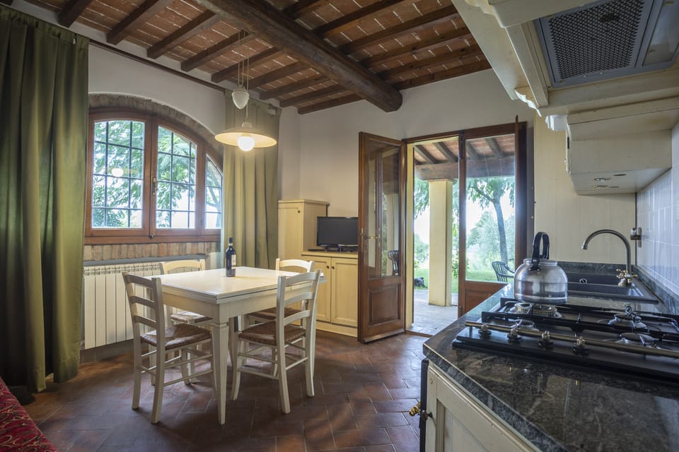 Apartment, 1 Bedroom | Living area | 90-cm flat-screen TV with cable channels, TV, table tennis