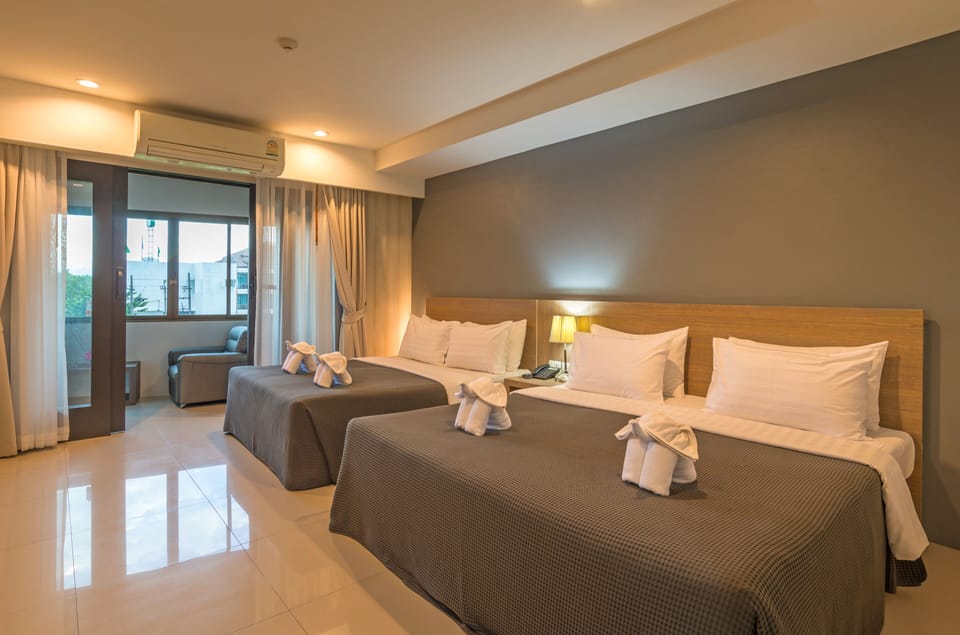 Deluxe Quadruple Room, Balcony | Free minibar, in-room safe, desk, rollaway beds