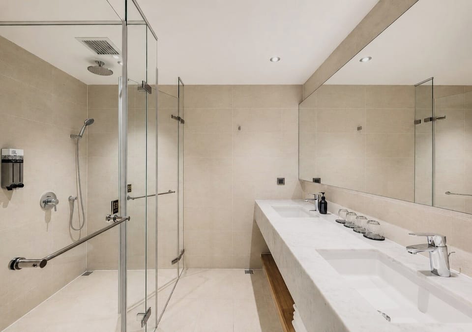 Deluxe Quadruple Room | Bathroom | Hair dryer, slippers, towels