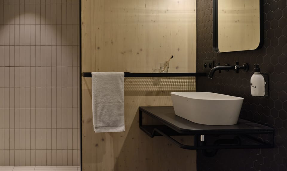 Shower, rainfall showerhead, hair dryer, towels