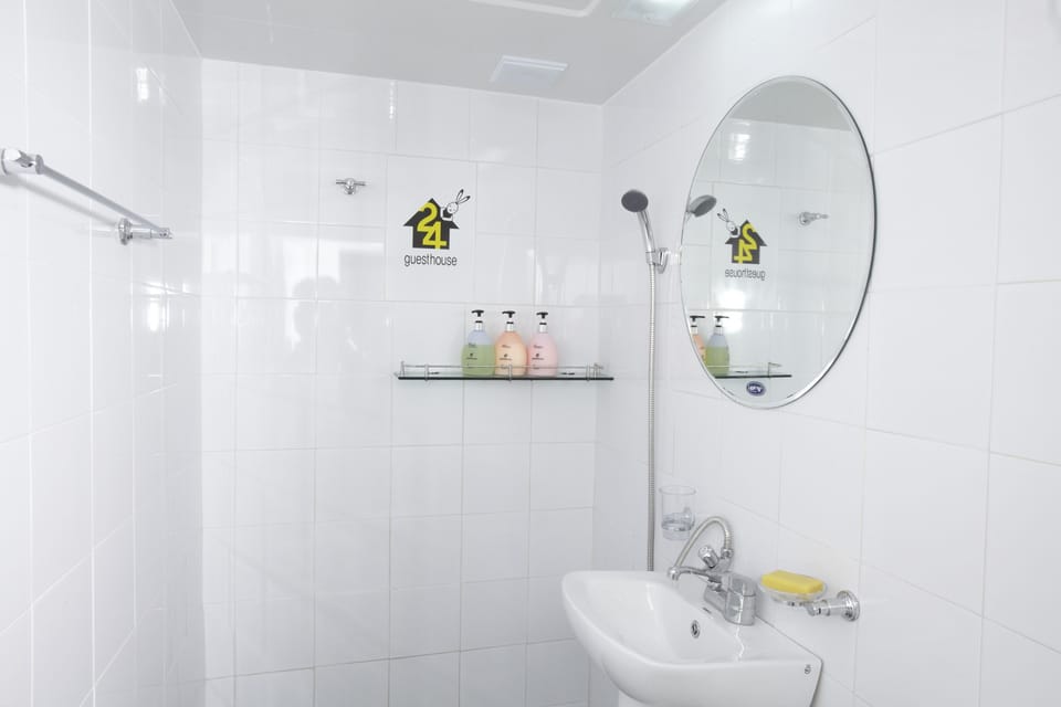Shower, hair dryer, slippers, towels