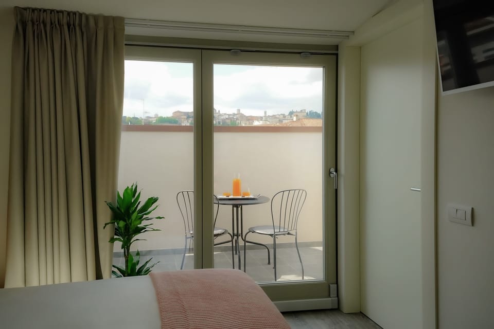 Deluxe Room, City View | Premium bedding, down comforters, minibar, in-room safe