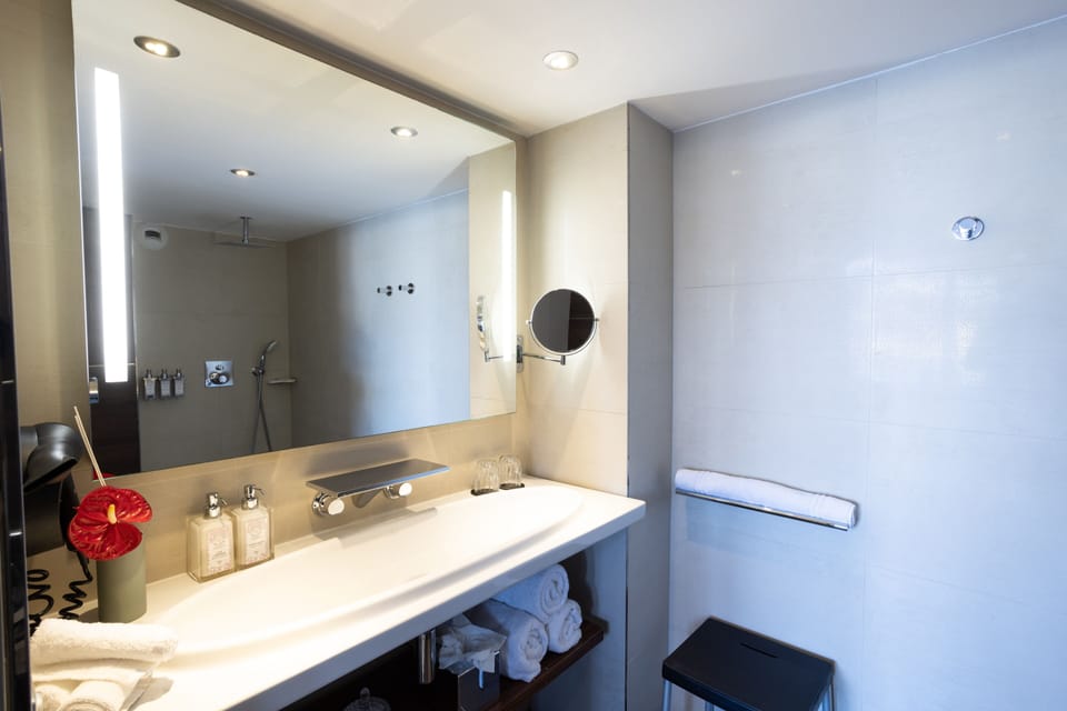 Suite, Sea View (Duplex) | Bathroom | Combined shower/tub, hair dryer, slippers, towels