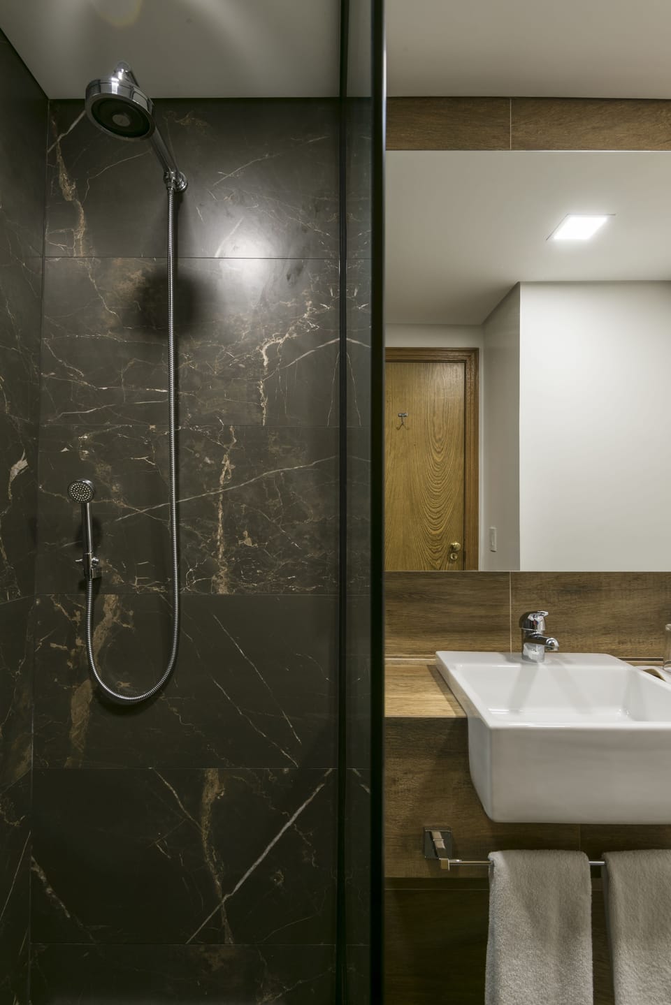 Shower, eco-friendly toiletries, hair dryer, towels