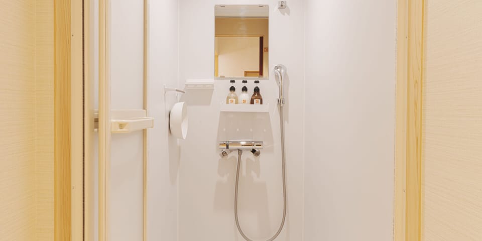 Shower, free toiletries, hair dryer, slippers