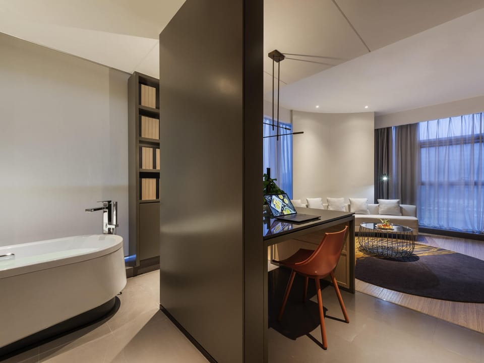 Deluxe Suite, 1 King Bed | Down comforters, minibar, soundproofing, free WiFi
