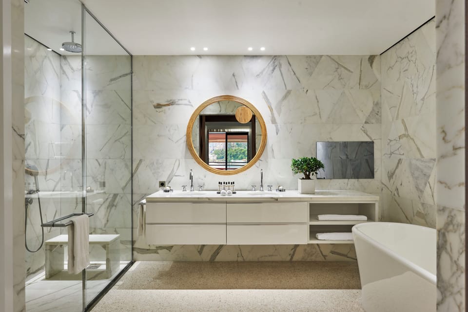 Junior Suite, Sea View | Bathroom | Designer toiletries, hair dryer, bathrobes, slippers