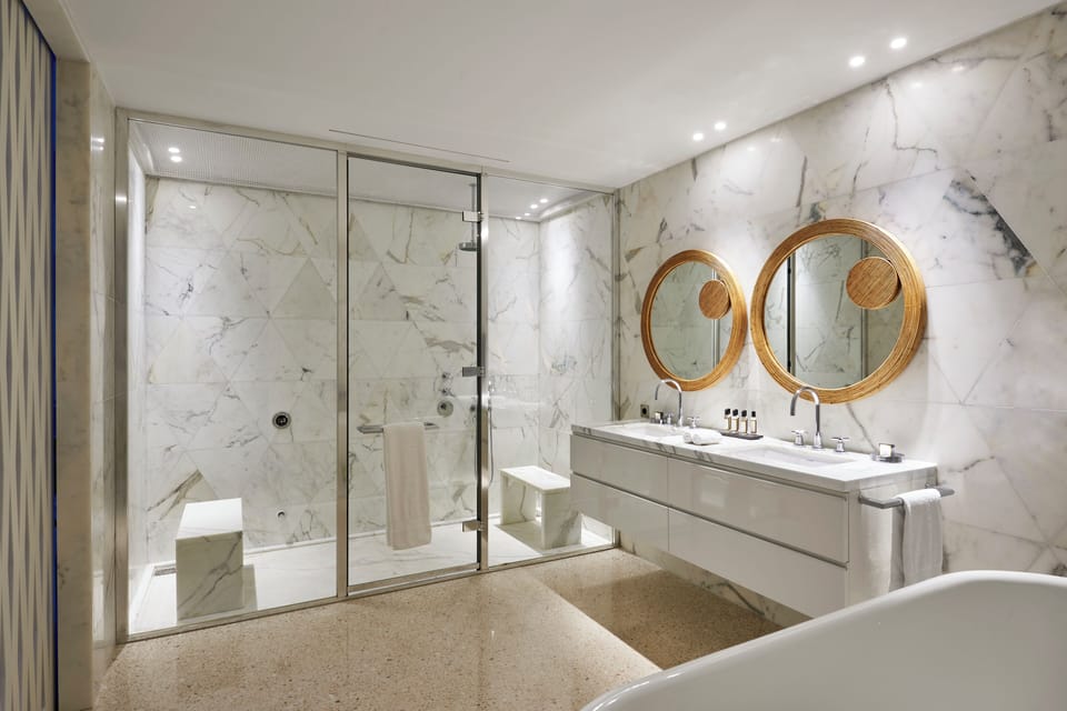 Suite, 2 Bedrooms | Bathroom | Designer toiletries, hair dryer, bathrobes, slippers
