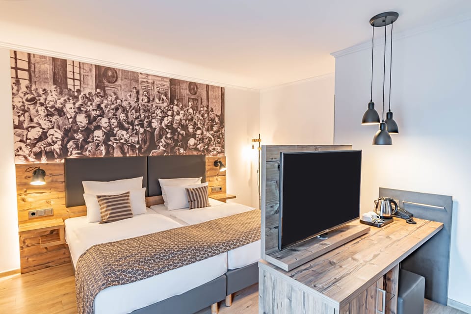 Junior Suite, Balcony, Garden View | Minibar, in-room safe, desk, soundproofing