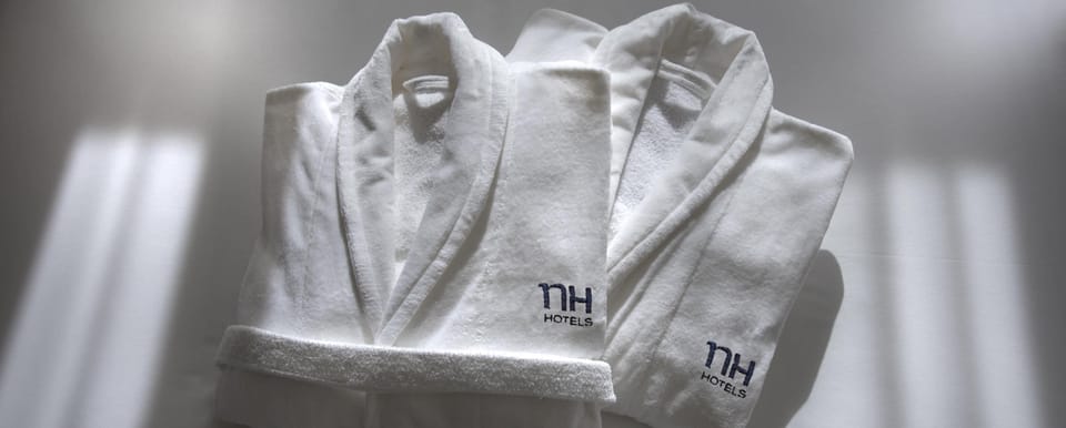 Shower, designer toiletries, hair dryer, towels