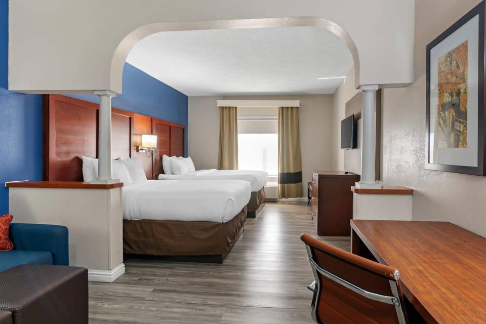 Suite, Multiple Beds, Non Smoking (2 Queen, 2 Person Sofa Bed) | In-room safe, desk, laptop workspace, blackout drapes