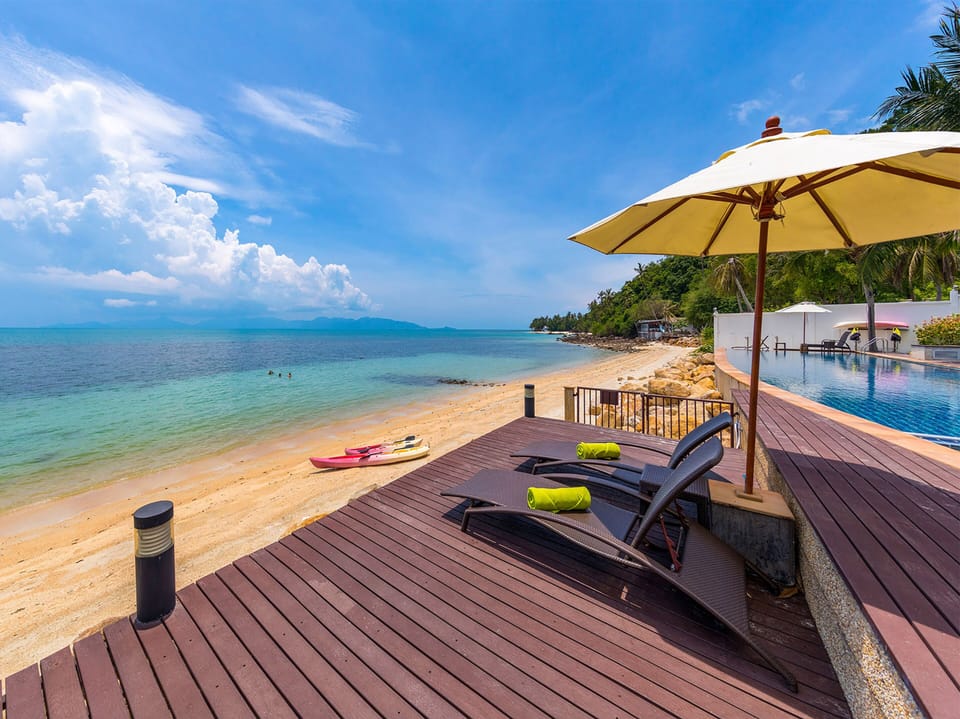 On the beach, sun loungers, beach umbrellas, beach towels