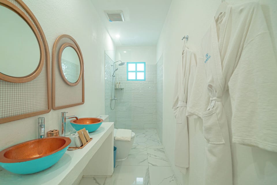 Wehang Suite with No View & No Window | Bathroom | Shower, hair dryer, bathrobes, slippers